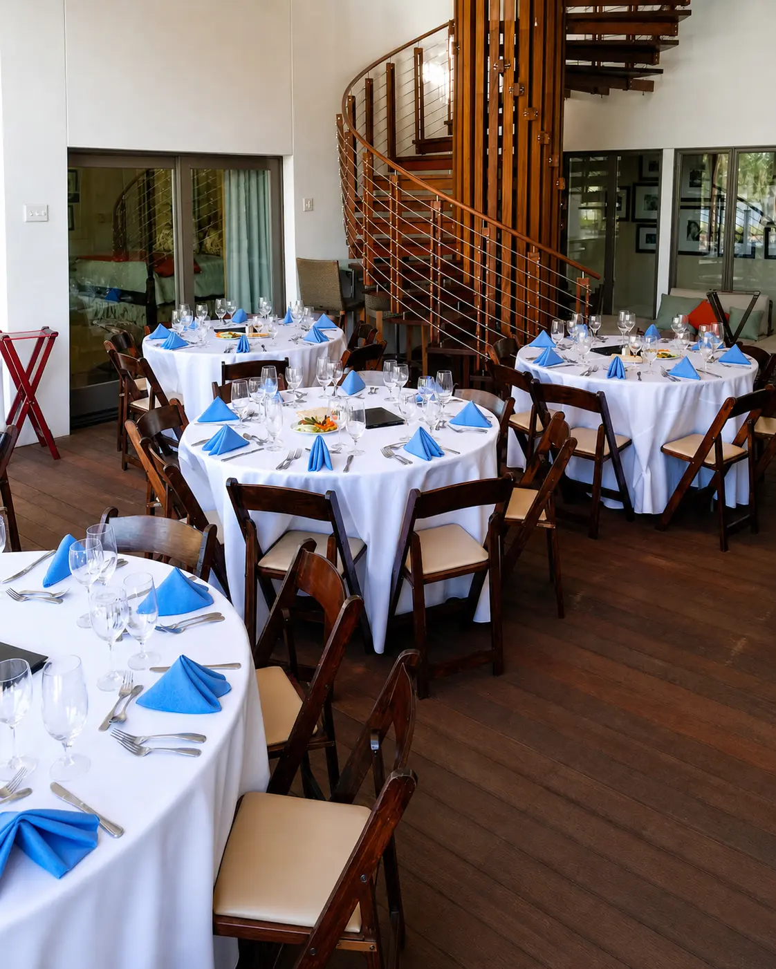 Dining tables prepared for guests at an H WAY event